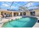 This backyard has a pool, a patio, and landscaping, creating a private oasis at 3880 Pinstar Ter, North Port, FL 34287