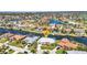 Aerial view of a waterfront community with houses lining the canals at 412 Panarea Dr, Punta Gorda, FL 33950