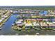 Aerial shot of a beautiful waterfront property with a private dock and scenic canal views at 412 Panarea Dr, Punta Gorda, FL 33950