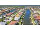 Aerial view of a stunning waterfront home with a private dock and canal access in a vibrant community at 412 Panarea Dr, Punta Gorda, FL 33950