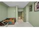 Basement with stairs, green walls, and carpet at 412 Panarea Dr, Punta Gorda, FL 33950