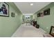 Finished basement with green walls, carpet, and an office area at 412 Panarea Dr, Punta Gorda, FL 33950