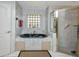 Elegant bathroom with a large soaking tub, glass-enclosed shower, and tiled walls at 412 Panarea Dr, Punta Gorda, FL 33950