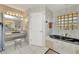 Lavish bathroom featuring a soaking tub, glass-enclosed shower, vanity, and tiled walls at 412 Panarea Dr, Punta Gorda, FL 33950