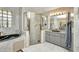 Luxurious bathroom with a soaking tub, stand-alone shower and tiled walls at 412 Panarea Dr, Punta Gorda, FL 33950