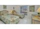 Bright bedroom with two twin beds and waterfront view at 412 Panarea Dr, Punta Gorda, FL 33950