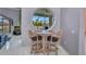 Dining area with views of the canal visible through the unique round window at 412 Panarea Dr, Punta Gorda, FL 33950