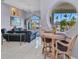 Dining area with views of the canal visible through the unique round window at 412 Panarea Dr, Punta Gorda, FL 33950
