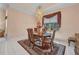 Charming dining room featuring an elegant light fixture, window, and decor with a patterned rug and lots of space at 412 Panarea Dr, Punta Gorda, FL 33950
