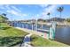 Home featuring a well-maintained dock with boat lift access on a tranquil canal at 412 Panarea Dr, Punta Gorda, FL 33950