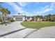 Attractive home with a well-kept lawn, landscaping, and a circular paved driveway at 412 Panarea Dr, Punta Gorda, FL 33950