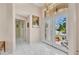 Grand foyer with tile flooring, chandelier, and decorative glass front doors at 412 Panarea Dr, Punta Gorda, FL 33950