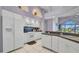 Kitchen featuring white appliances and white cabinets at 412 Panarea Dr, Punta Gorda, FL 33950