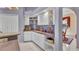 Kitchen featuring white cabinets, unique display shelving, and tile flooring at 412 Panarea Dr, Punta Gorda, FL 33950