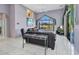 Bright living room featuring tile floors, leather furniture, and views of the canal at 412 Panarea Dr, Punta Gorda, FL 33950