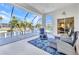 Screened patio with comfortable seating overlooking a canal at 412 Panarea Dr, Punta Gorda, FL 33950