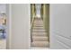 Carpeted stairwell leading to upper level at 412 Panarea Dr, Punta Gorda, FL 33950