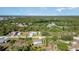 Aerial view of a home nestled among lush greenery, showcasing its location and neighborhood at 422 Ravenswood Blvd, Port Charlotte, FL 33954
