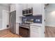 Modern kitchen featuring stainless steel appliances, sleek cabinets, and modern lighting, offering a functional cooking space at 422 Ravenswood Blvd, Port Charlotte, FL 33954