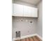 Bare laundry room with hookups and white cabinets at 422 Ravenswood Blvd, Port Charlotte, FL 33954