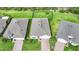 Aerial view of a single-Gathering home with a manicured lawn and brick paver driveway at 4244 Manatee Ln, Punta Gorda, FL 33980