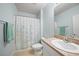 Neutral bathroom with white vanity, shower and decor at 4244 Manatee Ln, Punta Gorda, FL 33980