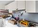 Kitchen featuring white cabinets, tiled backsplash, and stainless steel knives showcasing a home's interior at 4645 80Th N St, St Petersburg, FL 33709