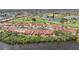 Beautiful aerial view showcasing waterfront homes, a golf course, and picturesque lakes at 5036 San Rocco Ct, Punta Gorda, FL 33950