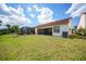 Spacious backyard featuring a screened-in patio for outdoor relaxation and entertaining at 5036 San Rocco Ct, Punta Gorda, FL 33950