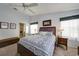 Comfortable bedroom with a queen bed, plush carpet, soft lighting, and a view to an ensuite bathroom at 5036 San Rocco Ct, Punta Gorda, FL 33950