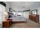 Bright bedroom with carpet, ceiling fan, nice view to the enclosed lanai, and furniture at 5036 San Rocco Ct, Punta Gorda, FL 33950