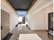 Bright tiled courtyard with seating area, arched doorway, and multiple entrances at 5036 San Rocco Ct, Punta Gorda, FL 33950