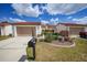 Charming townhomes featuring red tile roofs, inviting walkways, and attached garages at 5036 San Rocco Ct, Punta Gorda, FL 33950