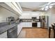 Modern kitchen featuring granite countertops, stainless steel appliances, and ample cabinetry at 5036 San Rocco Ct, Punta Gorda, FL 33950