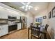 Kitchen with stainless appliances and a dining area, perfect for enjoying meals at home at 5036 San Rocco Ct, Punta Gorda, FL 33950