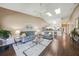 Spacious living room with hardwood floors, vaulted ceilings, and a comfortable seating area at 5036 San Rocco Ct, Punta Gorda, FL 33950