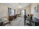 Well-lit home office space with multiple workstations and large windows at 5036 San Rocco Ct, Punta Gorda, FL 33950