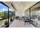 Cozy screened patio features tile flooring, comfortable seating and an enjoyable view of the tropical garden at 5036 San Rocco Ct, Punta Gorda, FL 33950