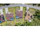 An aerial view of this lovely home and its surrounding neighborhood, complete with a refreshing pool at 5125 Ariton Rd, North Port, FL 34288