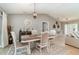 Bright dining area with a decorative rug, modern chandelier, and seating for four at 5125 Ariton Rd, North Port, FL 34288