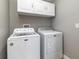 Bright laundry room with a modern washer and dryer at 5125 Ariton Rd, North Port, FL 34288