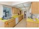 Eat-in kitchen with ample cabinetry, laminate counters, and built-in appliances at 535 Ramblewood St, Port Charlotte, FL 33953