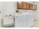 Bright laundry room with modern washing machine and dryer units at 535 Ramblewood St, Port Charlotte, FL 33953