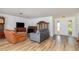 Spacious living room with a neutral color palette and laminate wood flooring at 535 Ramblewood St, Port Charlotte, FL 33953