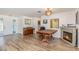Comfortable living room featuring an electric fireplace and laminate wood flooring at 535 Ramblewood St, Port Charlotte, FL 33953