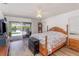 Bright main bedroom with waterfront access and a charming grandfather clock at 535 Ramblewood St, Port Charlotte, FL 33953