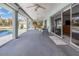 Large, covered outdoor patio area with waterfront and pool access at 535 Ramblewood St, Port Charlotte, FL 33953