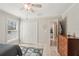 Cozy bedroom featuring a double closet, natural light, and wood flooring at 5805 Casanova Ave, North Port, FL 34291