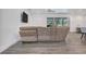 Bright, modern living room featuring vinyl plank flooring and a comfortable sofa at 7344 Manthey Ave, North Port, FL 34291
