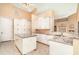Spacious kitchen with a granite island, stainless steel appliances, and ample storage space at 850 Napoli Ln, Punta Gorda, FL 33950